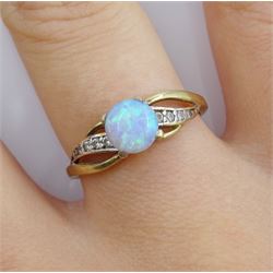Gold opal ring with cubic zirconia shoulders, stamped 9K