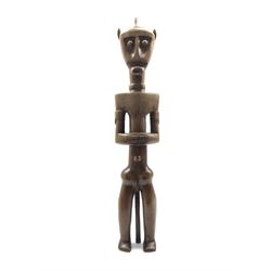Fang carved hardwood ancestor figure formed as a standing male H66cm
