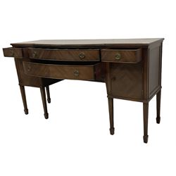 19th century mahogany sideboard, shaped rectangular top with reeded edge, fitted with two bow-front drawers flanked by cupboards, raised on fluted moulded square tapering supports with spade feet
