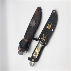 Military Knife and a Knife with a Cowboy Motif