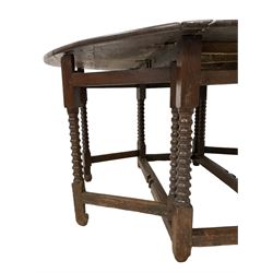 17th century oak drop-leaf dining table, oval top raised on turned supports with double gate-leg action on each side, united by stretchers with carved rails