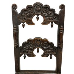 19th century oak Yorkshire side chair, double shaped rail back carved with scrolls and masks, applied split mouldings, panelled seat on turned supports 