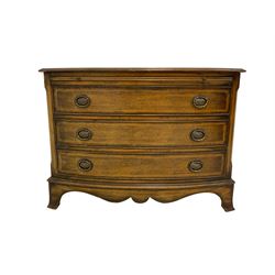 Georgian style mahogany bow front chest, the top with satinwood stringing and inlaid with central kylix decoration, fitted with brushing slide with leather inset over three cockbeaded drawers, shaped apron flanked by bracket feet