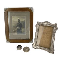 Leather upright photograph frame with silver corners, import marks for Birmingham 1901, aperture size 21cm x 16cm, smaller embossed silver frame, small silver filigree box with hinged cover and a 19th century patch box with shell inlay