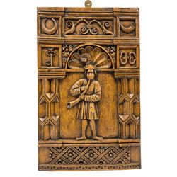 Reproduction panel after the 16th century Percy family oak panels found in the Percy Inn on Walmgate - York, depicts a man playing horn, above the musician are four Percy badges, the crescent moon, the crowned key, the bugle-horn and the pair of manacles 50cm x 32cm