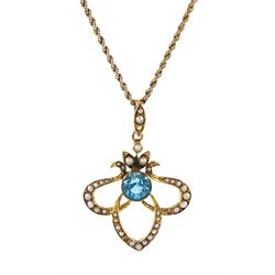 Edwardian gold blue zircon and seed pearl pendant, stamped 9ct, on 9ct gold rope twist necklace, boxed
