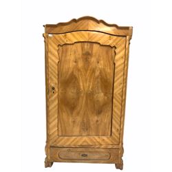 Continental walnut veneered wardrobe, arched top over panelled door enclosing interior fitted for hanging, one drawer to base, raised on block supports (W102cm, H186cm) together with a mirror of similar design (62cm x 173cm)