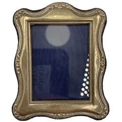 Late Victorian silver oval photograph frame with bead edge decoration, aperture size 7cm x 6cm, Birmingham 1900, a rectangular frame, aperture size 12cm x 8.5cm, Sheffield 1996 and a small silver frame (3)