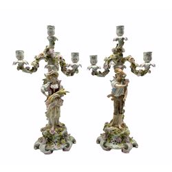 Pair of Sitzendorf porcelain candelabra depicting male and female figures gathering wheat sheaves, supporting four floral encrusted branches, H51cm 