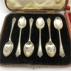 Set of six silver gilt Anointing spoons, cased Birmingham 1951 Maker Adie Bros., set of six silver coffee spoons with shaped finials and another set of six silver coffee spoons