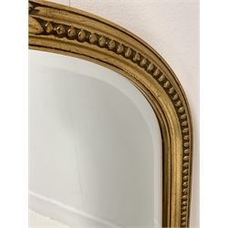 20th century gilt framed wall mirror, the arched frame with beaded and floral moulding enclosing bevelled plate 
