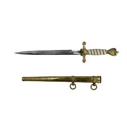 German Kriegsmarine Naval Dirk the 25cm stiletto blade etched with scrolls and anchors and marked 'Original Eickhorn Solingen', gilded crossguard with central fouled anchor and push button scabbard lock, cream celluloid wire wound grip, eagle and swastika pommel, brass scabbard with twin suspension rings