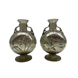 Pair of Bohemian glass vases attributed to Moser c1900, twin handled globular form, enamelled and gilded with stylised fish swimming amongst reeds, H23cm 