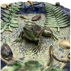 19th century French Palissy ware dish, a frog applied to the middle on a textured blue ground surrounded by shells, insects, snail, lizard, snake, fern leaf and other foliage, with bottled blue exterior, unmarked, D28cm