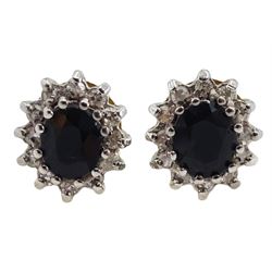 Pair of 9ct gold sapphire and diamond chip cluster stud earrings, hallmarked 