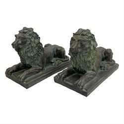 Pair bronze finish cast stone recumbent lions, on rectangular plinth base