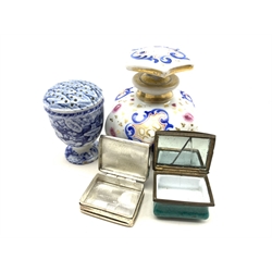 A French porcelain scent bottle of hexagonal form, 18th century enamel patch box, the lid decorated with floral sprays, silver and enamel pill box the cover decorated with Huntsmen on horseback stamped 925, a circular silver-plated trinket box, relief decorated with birds in a nest and a 19th century transfer printed pepper pot (5)