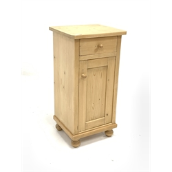Polished pine bedside cupboard, fitted with drawer over panelled door enclosing one shelf 