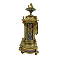 Gilt and porcelain mounted mantle clock, third quarter 19th century, with five Sevres style porcelain panels and urn, Roman numeral cartouche dial decorated with a shepherd and shepherdess in 18th century dress within light blue and gilt borders, with a twin-handled garland decorated urn above, case with reeded canted corners on a shaped plinth base with cast disc feet, eight-day rack striking Parisian movement striking the hours and half-hours on a bell, movement stamped Japy Feres Paris.
With key and pendulum



