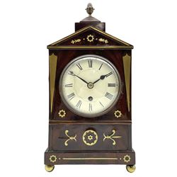 A small William IV brass inlaid mahogany bracket clock with an eight-day timepiece movement, c1835, single fusee movement and recoil anchor escapement, white enamel dial with Roman numerals, minute track and tapered steel spade hands, with a brass bezel and convex glass, the architectural top case with pineapple finial to the square surmount above, the case with brass inlaid canted angles and decorative brass inlay to the rectangular panel beneath the dial, on a plinth base with ball feet.