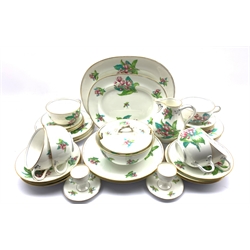 Early 20th century porcelain tea and dinner service, each piece hand-painted with floral sprigs on a plain ground with naturalistic twist hands, pattern no. 96491