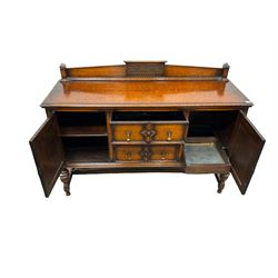 Early 20th century oak sideboard, the raised back over two drawers flanked by two cupboards, raised on turned supports united by a stretcher W151cm, H100cm, D50cm 