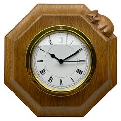 Mouseman - oak and brass wall clock, circular Roman dial in brass drum on moulded octagonal mount carved with mouse signature, fitted with battery operated Quartz movement, by the workshop of Robert Thompson, Kilburn