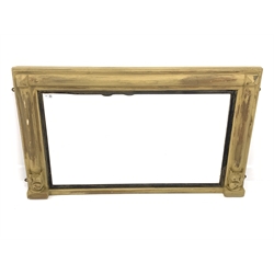 19th century over mantel mirror, the frame with half round pilasters terminating in carved acanthus leaves, enclosing ebonised and reeded slip and mirrored plate, 110cm x 67cm