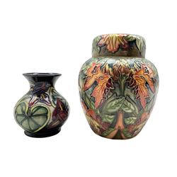 Moorcroft 'Flames of the Forest' pattern ginger jar and cover by Philip Gibson, dated 1997 H16cm together with a Moorcroft Palmata pattern vase designed by Shirley Hayes, dated 1999 H10cm (2)