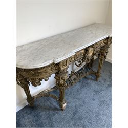 19th century French ornate gilt wood and gesso console table, the moulded white variegated marble top over applied egg and dart and floral decoration to frieze centred  by a roundel depicting Napoleon issuing floral swags and acanthus leaf, raised on turned fluted supports united by shaped stretcher with shell and acanthus leaves W169cm, H94cm, D51cm