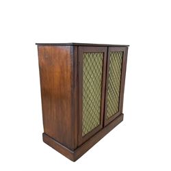 Mahogany side cupboard, fitted with two mesh doors, opening to reveal one shelf, raised on a plinth base 