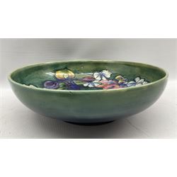 Walter Moorcroft Orchid pattern bowl on a green wash ground, impressed and painted marks beneath, D27cm 