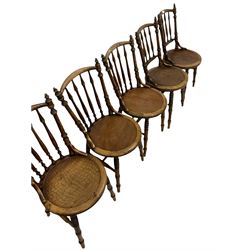 Pair of bentwood chairs, the spindle back over circular seat, raised on turned supports, unite by a stretcher together with three other chairs of similar design 