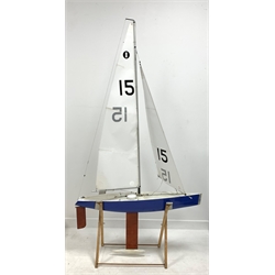 Remote controlled fibreglass pond yacht with nylet sails , weighted keel in blue and white livery with additional sails L100cm x H178cm from top of mast to bottom of keel