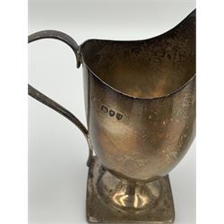 Georgian silver milk jug, late Victorian silver cream jug of helmet form on square foot, London 1891, two silver mustard pots, silver albert chain with Heuer stopwatch, etc, weighable silver 10.1 ozt 