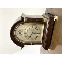 Late 19th/ Early 20th century mahogany cased ting tang bracket clock by Winterhalder & Hofmeier, the arched case over bevel glazed bezel and quarter round fluted pilasters with brass mounts, stepped base, raised on brass bracket supports, silvered dial with Roman chapter ring and slow fast function, eight day movement inscribed 'W&H SCH' striking on two coils