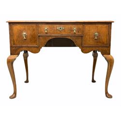 Queen Anne style walnut lowboy, the top with herringbone inlay and moulded edge over three oak lined drawers and a shaped apron, raised on cabriole supports W104cm