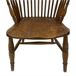 19th century elm and ash Windsor chair, high hoop and stick back over shaped saddle seat, raised on ring turned supports united by H-stretcher