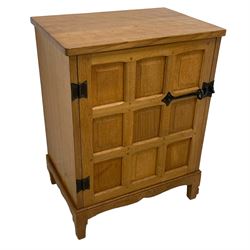 Beaverman - adzed oak cupboard, enclosed by panelled door with wrought metal catch, adzed top and size, the interior fitted with shelf and divisions, on square tapering feet, carved with beaver signature, by Colin Almack, Sutton-under-Whitestone Cliffe, Thirsk