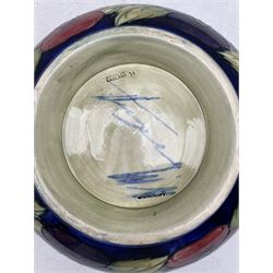 Moorcroft Pansy pattern pedestal bowl on a dark blue ground and with blue signature mark D26cm (a/f)
