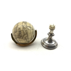 19th century ivory Terrestrial Globe with incised and black stained detail,  with spun brass bezel and later white metal stand, H8.5cm