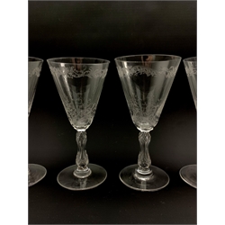 Set of seven early 20th century claret glasses decorated in the Baccarat style with foliate engraved bowls on faceted stems, one (a/f)