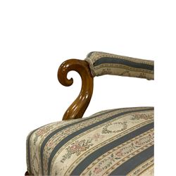 Pair of Victorian walnut drawing room armchairs, pierced shaped resting rail, the buttoned back and sprung seat upholstered in blue and ivory floral patterned fabric, the scrolled arm terminals over a shaped apron, raised on cabriole front supports