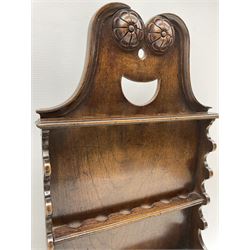 Pair of Georgian oak hanging spoon racks with pierced racks, lidded box to the base and rosette carving H62cm