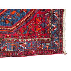 Persian Hamadan rug, the field decorated with overlapped extending lozenges with small stylised plant motifs, repeating geometric design border