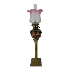 Brass oil lamp with Corinthian column, embossed reservoir and etched glass shade H78cm overall