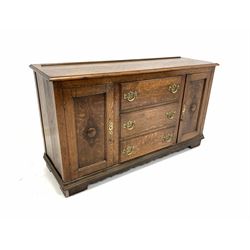 Early 20th century oak dresser base, fitted with two panelled cupboards and three drawers, raised on bracket supports W138cm, H78cm, D47cm