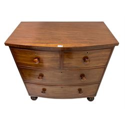 Late 19th century mahogany bow front chest, fitted with two short and three long drawers, raised on turned bun supports
