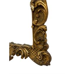 Gilt wall mirror, in ornate frame decorated with scrolling foliage and shell motif, bevelled plate