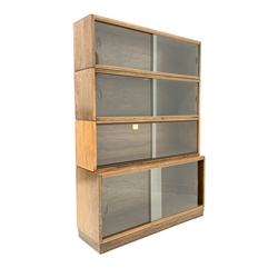  Early 20th century 'Simplex' oak stacking library bookcase with four shelves, each with sliding glass doors, W92cm, H131cm, D29cm  